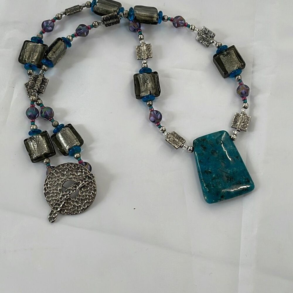 Chunky  glass metal and stone necklace .
